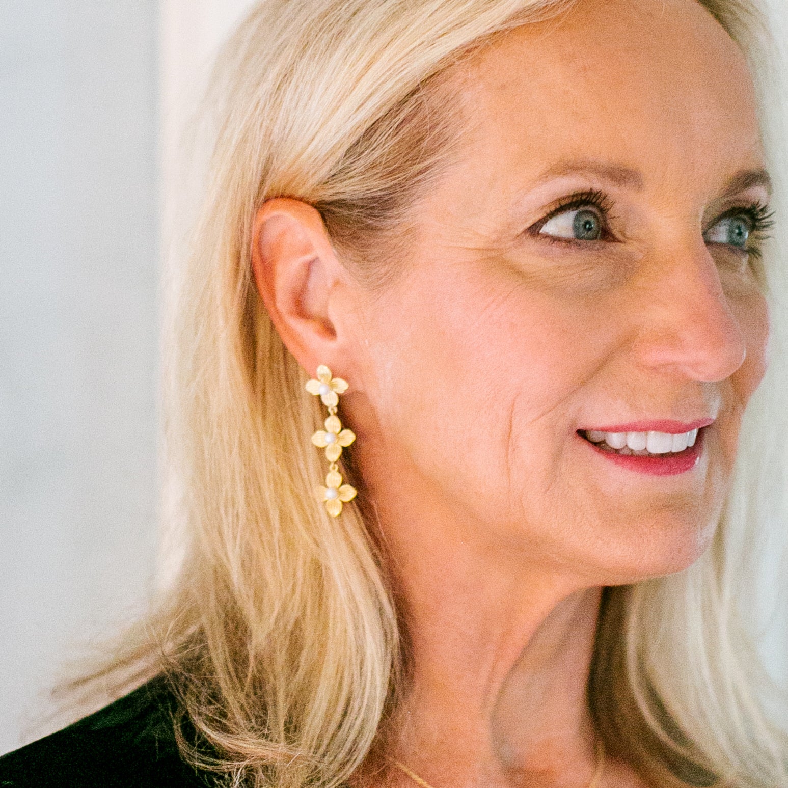 Model wears the Bloom Gold & Pearl Triple earrings_m donohue collection
