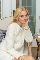 Model wearing Gold Lattice Cotton Pearl Triple Drop Earrings_M Donohue Collection