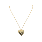 Gold heart-shaped pendant necklace on a white background_m donohue collection