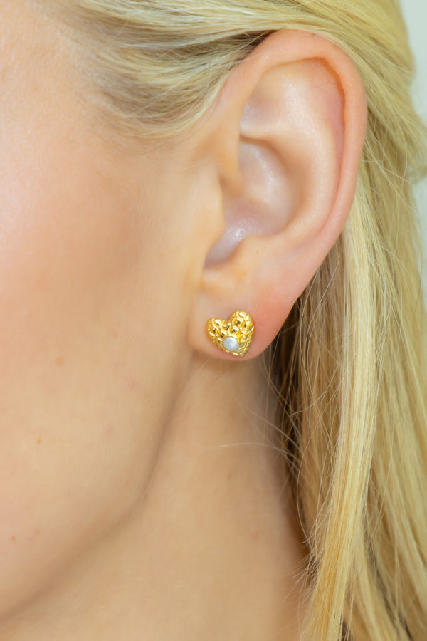 model wearing elizabeth tiny quilted heart stud earring_ m donohue collection