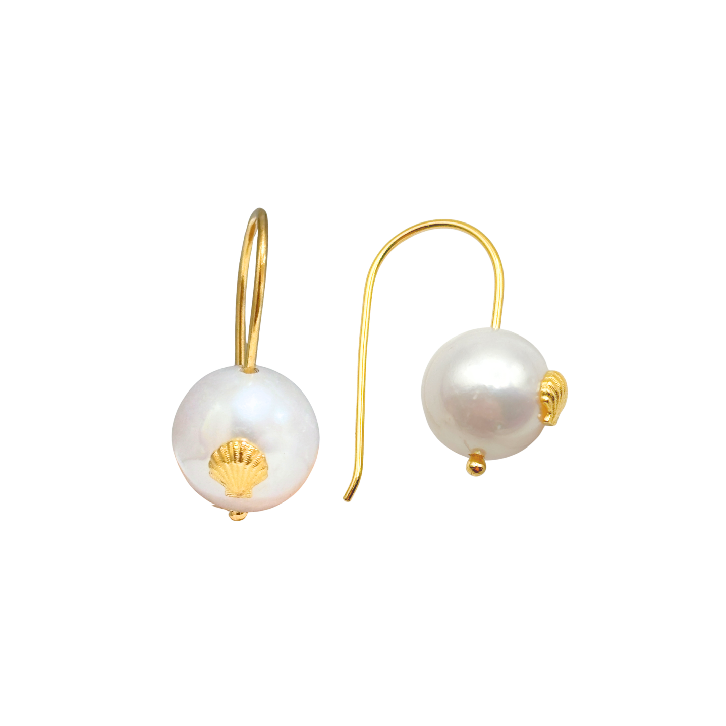 Pearl earrings with gold seashell and gold hooks on a white background