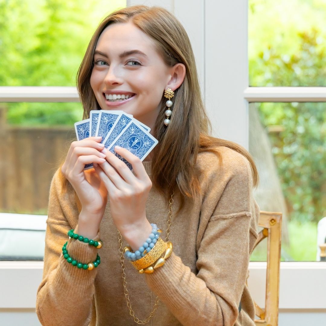 model wearing Jardin gold hydrangea post earrings with bracelets_m donohue collection