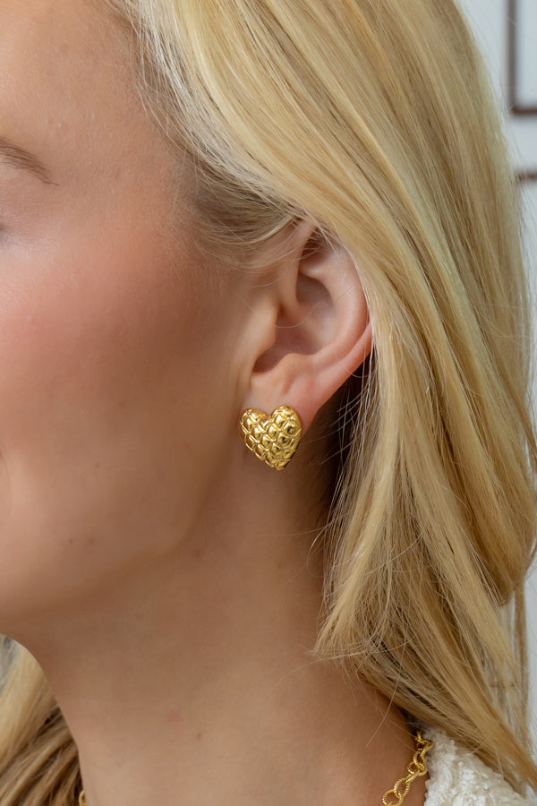 model wearing elizabeth tiny quilted heart stud earring_ m donohue collection