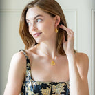 Model is wearing the Jardin Hydrangea Gold Hook earrings_m donohue collection