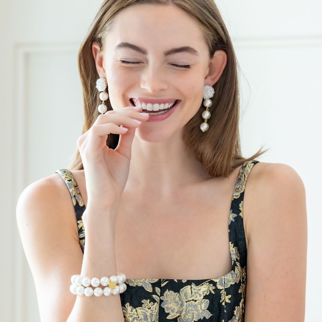 Model is wearing Liz Cotton Pearl Triple White Earrings_m donohue collection