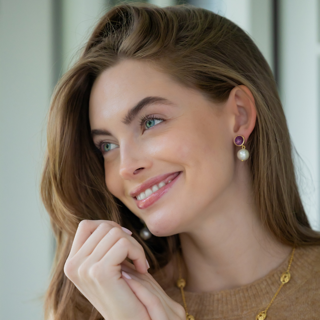 Model wears Triomphe Amethyst and Single Cotton Pearl Earrings_m donohue collection